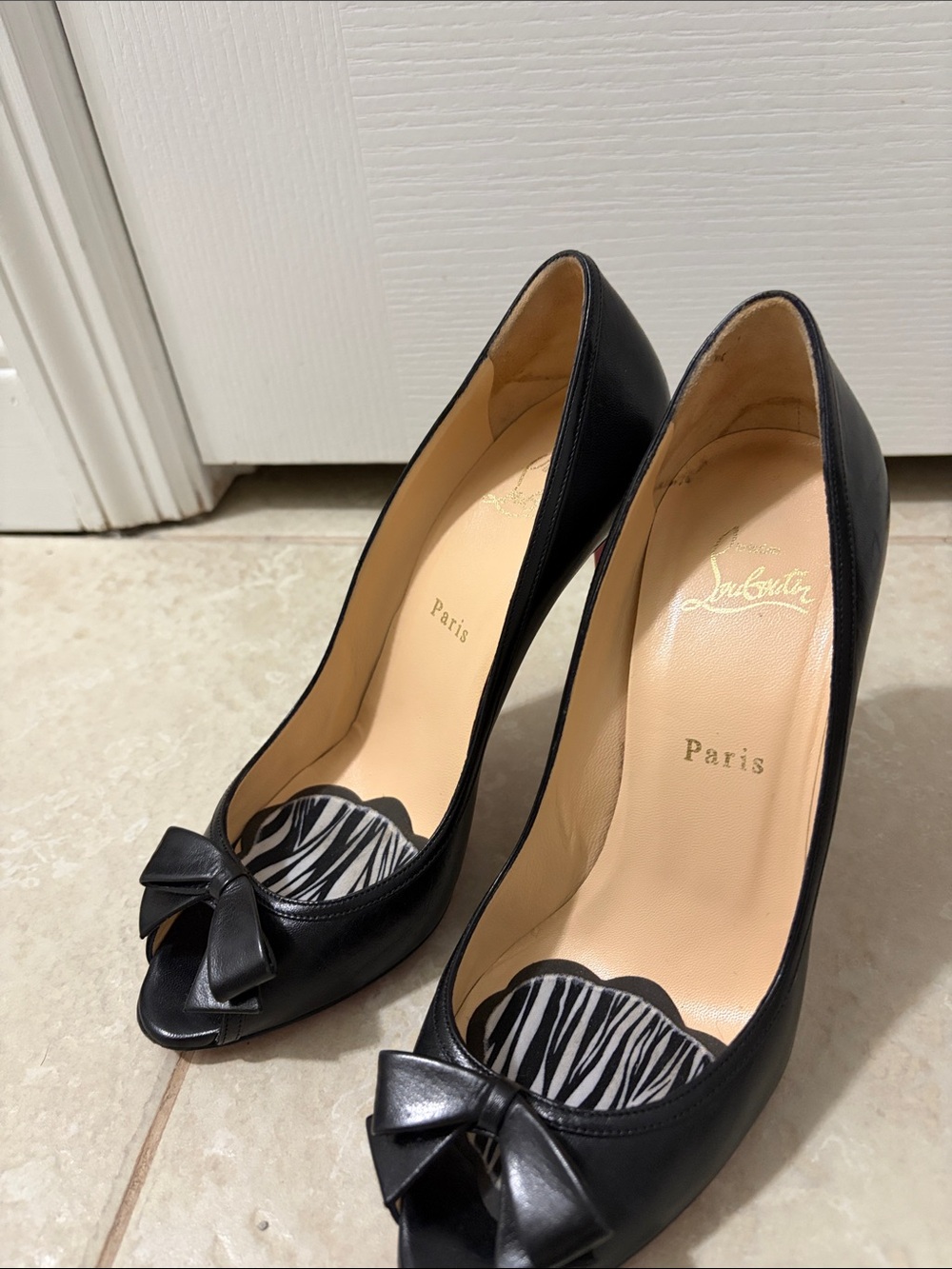 Christian Louboutin Black Peep-Toe Leather Pumps with Bow Accent.
